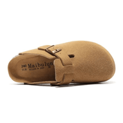 Clog Milan in light brown suede leather with natural cork sole and adjustable steel buckle, designed for all-day comfort.