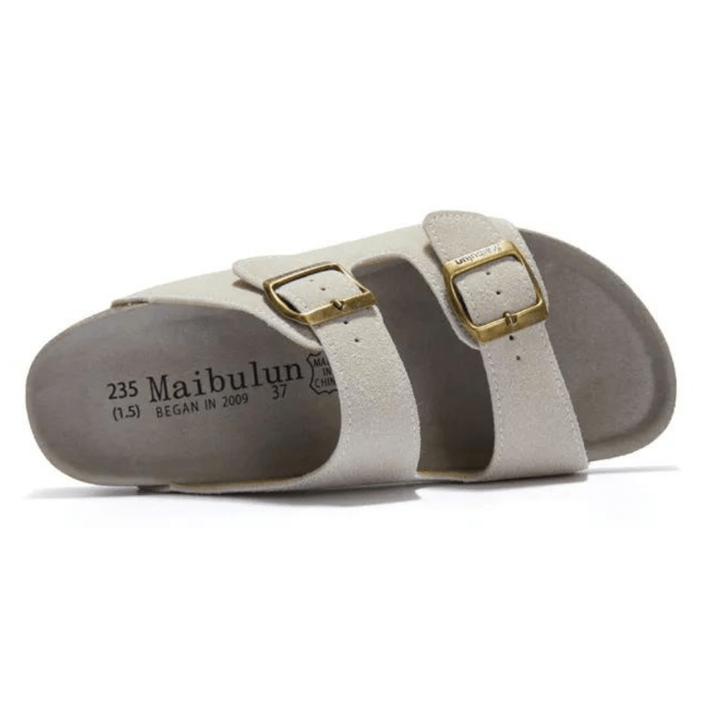 Vienna Sandals in cream suede with a soft texture, ergonomic sole, and adjustable straps for everyday elegance