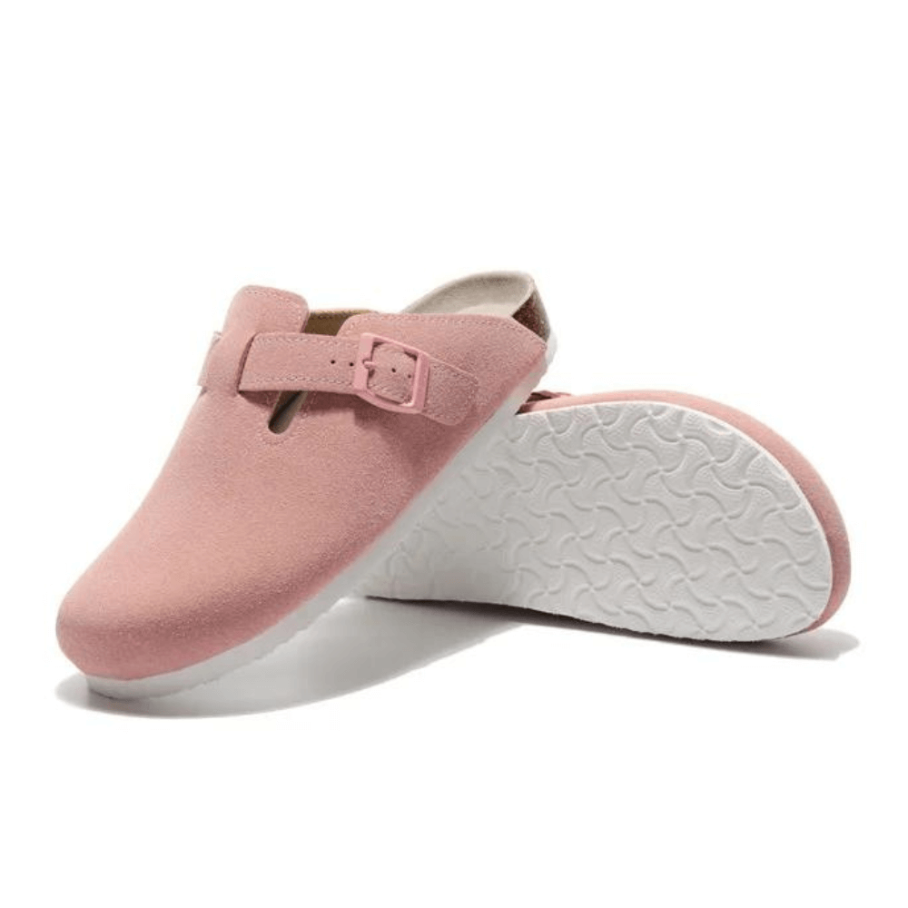 Pink wide fit clogs with adjustable buckle and anatomical sole, perfect for casual wear and everyday comfort.