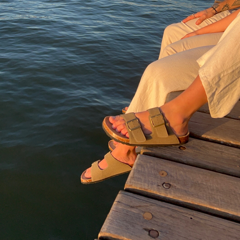 Vienna Sandals in moss green suede with a durable cork sole, adjustable straps, and a unique, natural tone